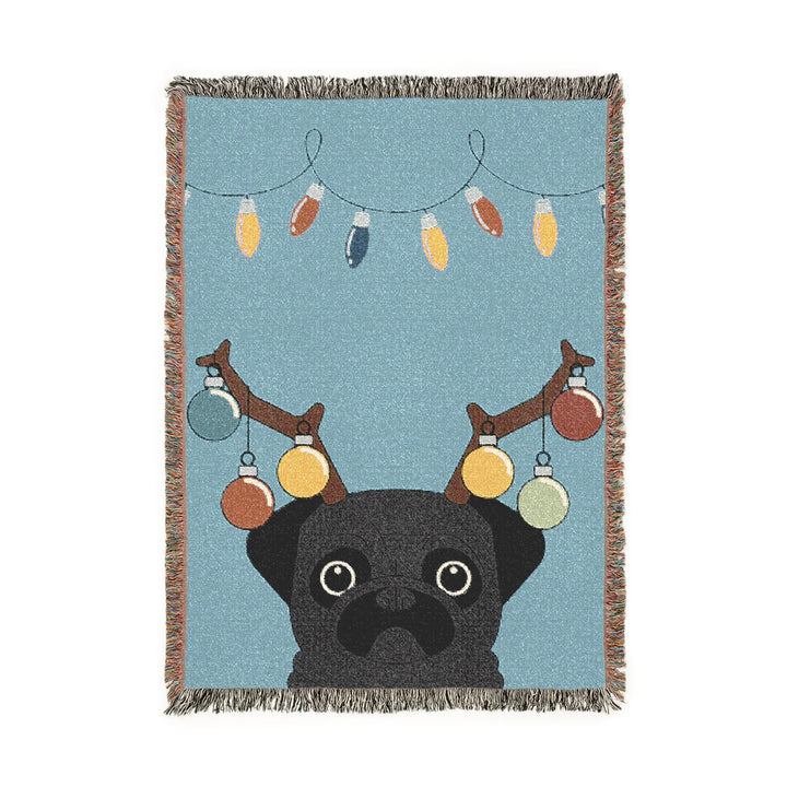 Blanket with a pug wearing reindeer antlers and Christmas lights on a blue background