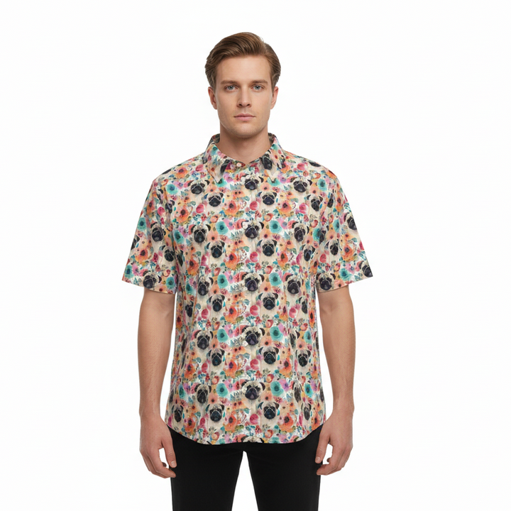 Man wearing a colorful floral short-sleeve shirt on a white background