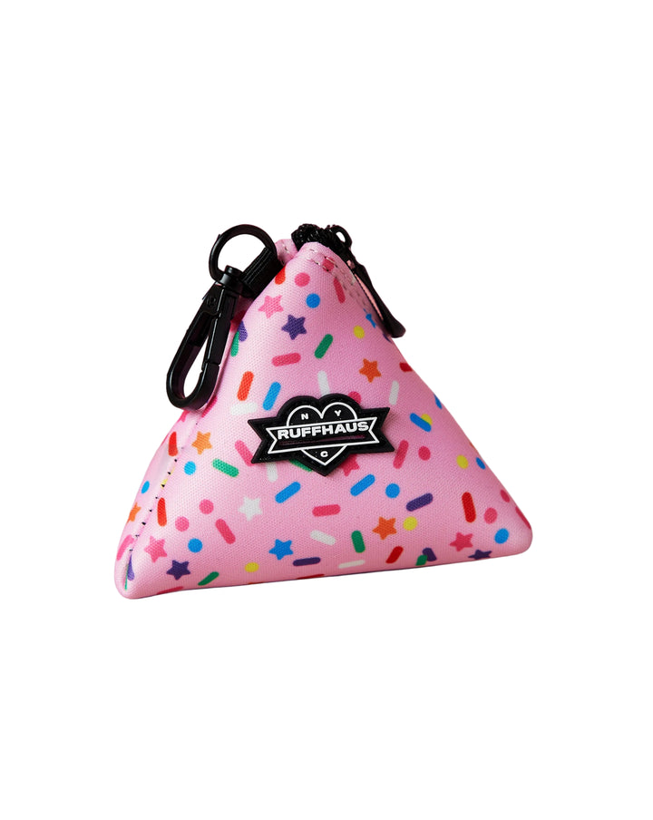 Pink triangular poop bag pouch with colorful sprinkles and a black zipper
